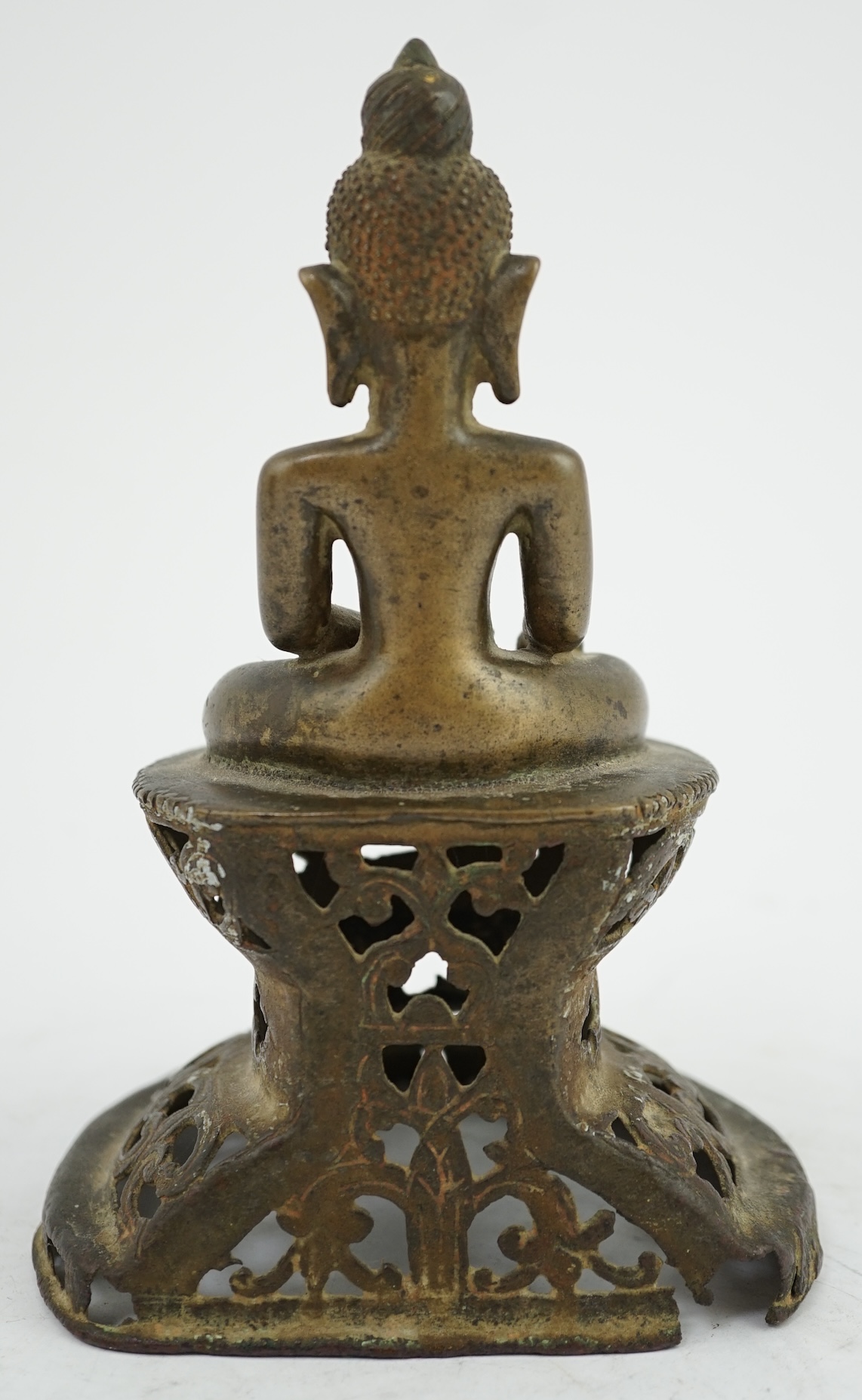 An unusual Burmese bronze seated figure of Buddha, 17th/18th century